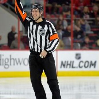 Garret Rank, 27, referees his second NHL game over the Carolina Hurricanes versus the New Jersey Devils on March 28, 2015 in Raleigh, North Carolina. (Photo by Sara D. Davis for The Waterloo Region Record)